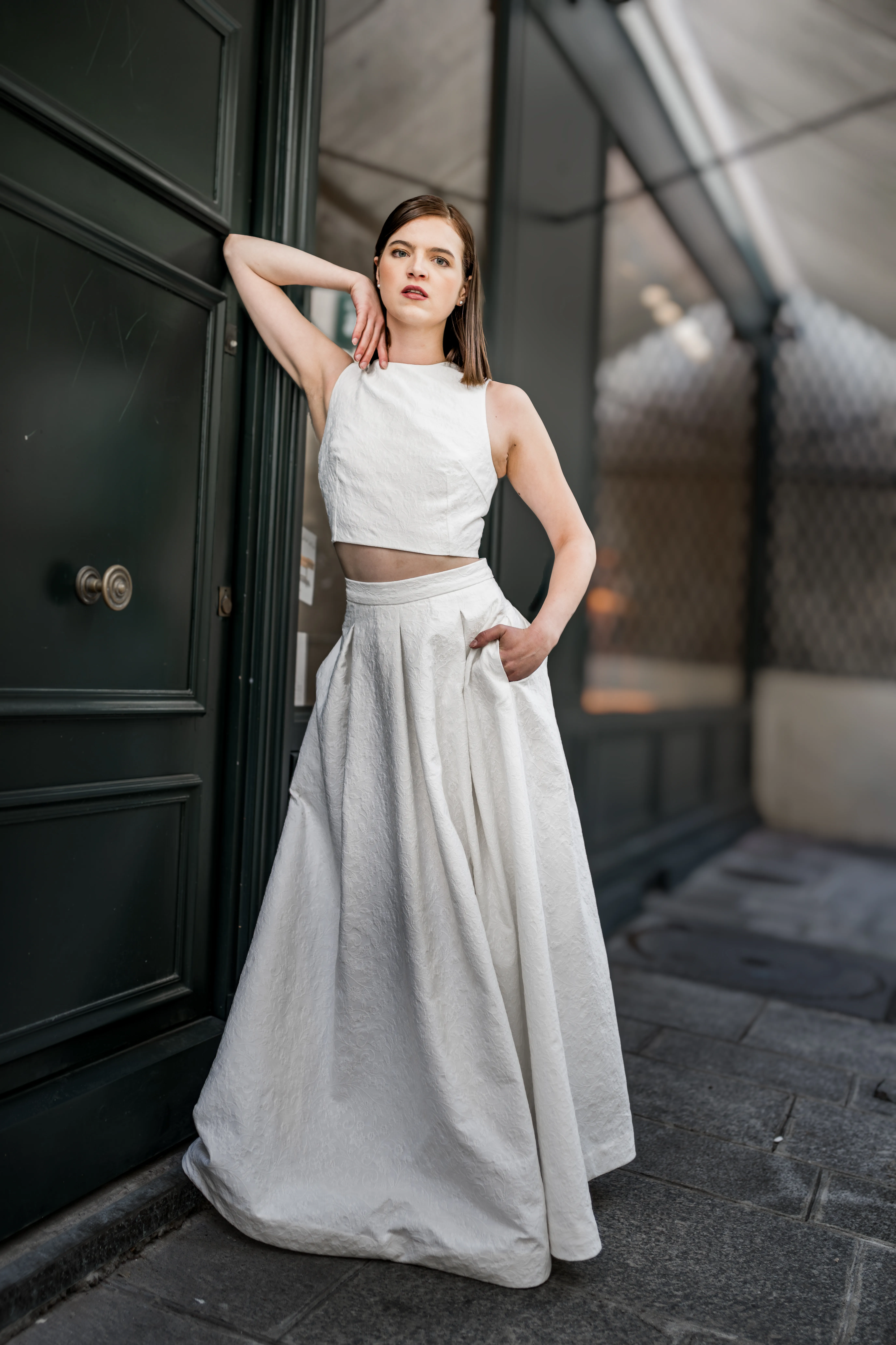 Model posing in front of a Door